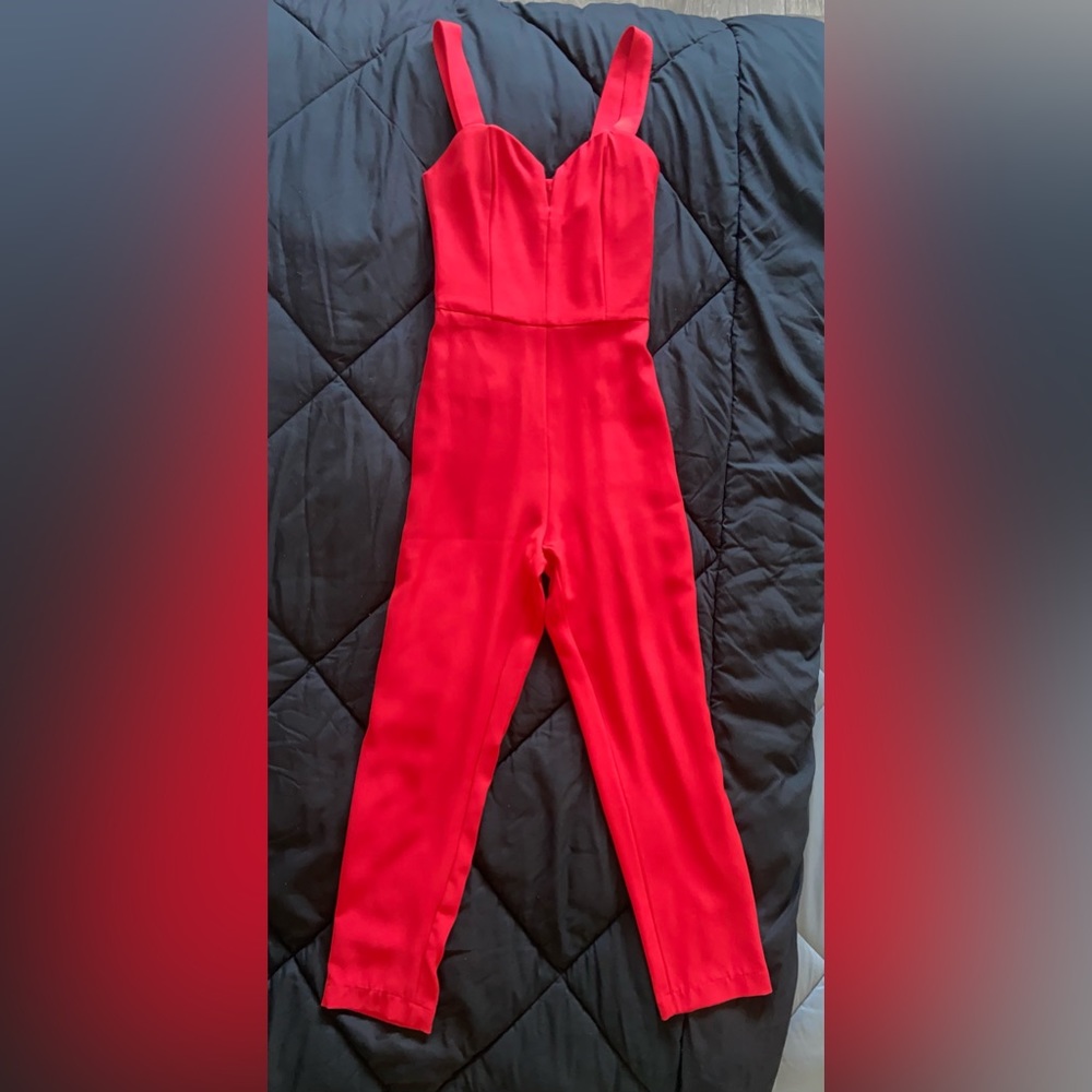 Cherry red H&M jumpsuit. It has a fitted bodice with flattering pants